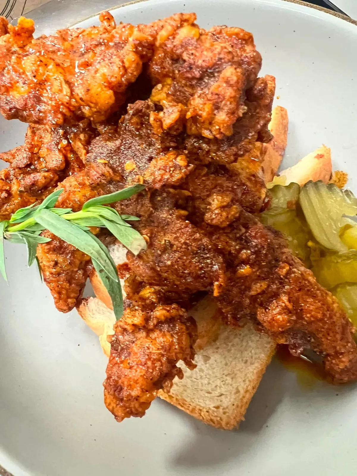 Nashville-style hot fried chicken over Texas toast with pickles