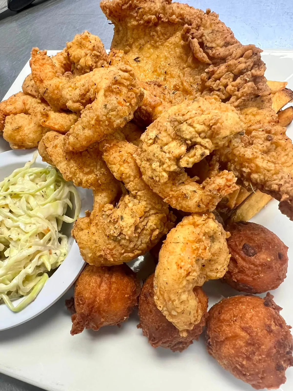 Golden fried shrimp and flounder basket with slaw and hushpuppies
